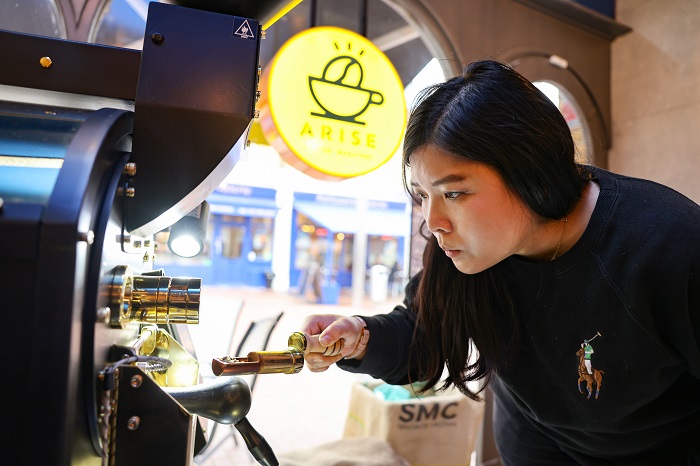 A person using a coffee machine