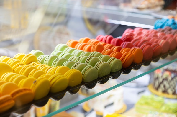 A display of different coloured macarons.