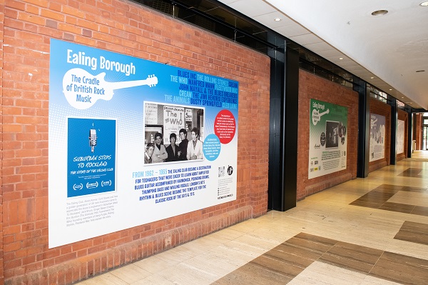 An alleyway with exhibition panel on the wall