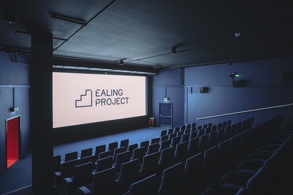 Scene inside cinema theatre showing Ealing Project logo on screen