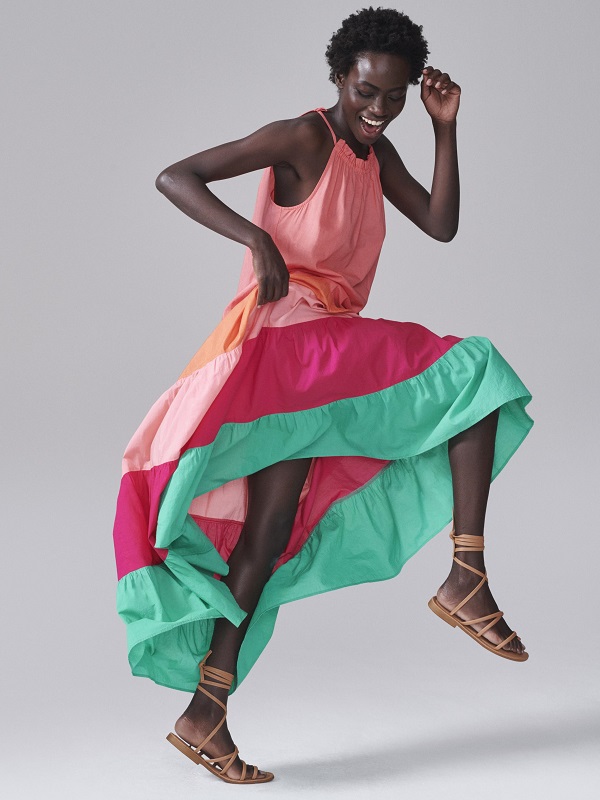 A model wearing a colourful dress from M&S